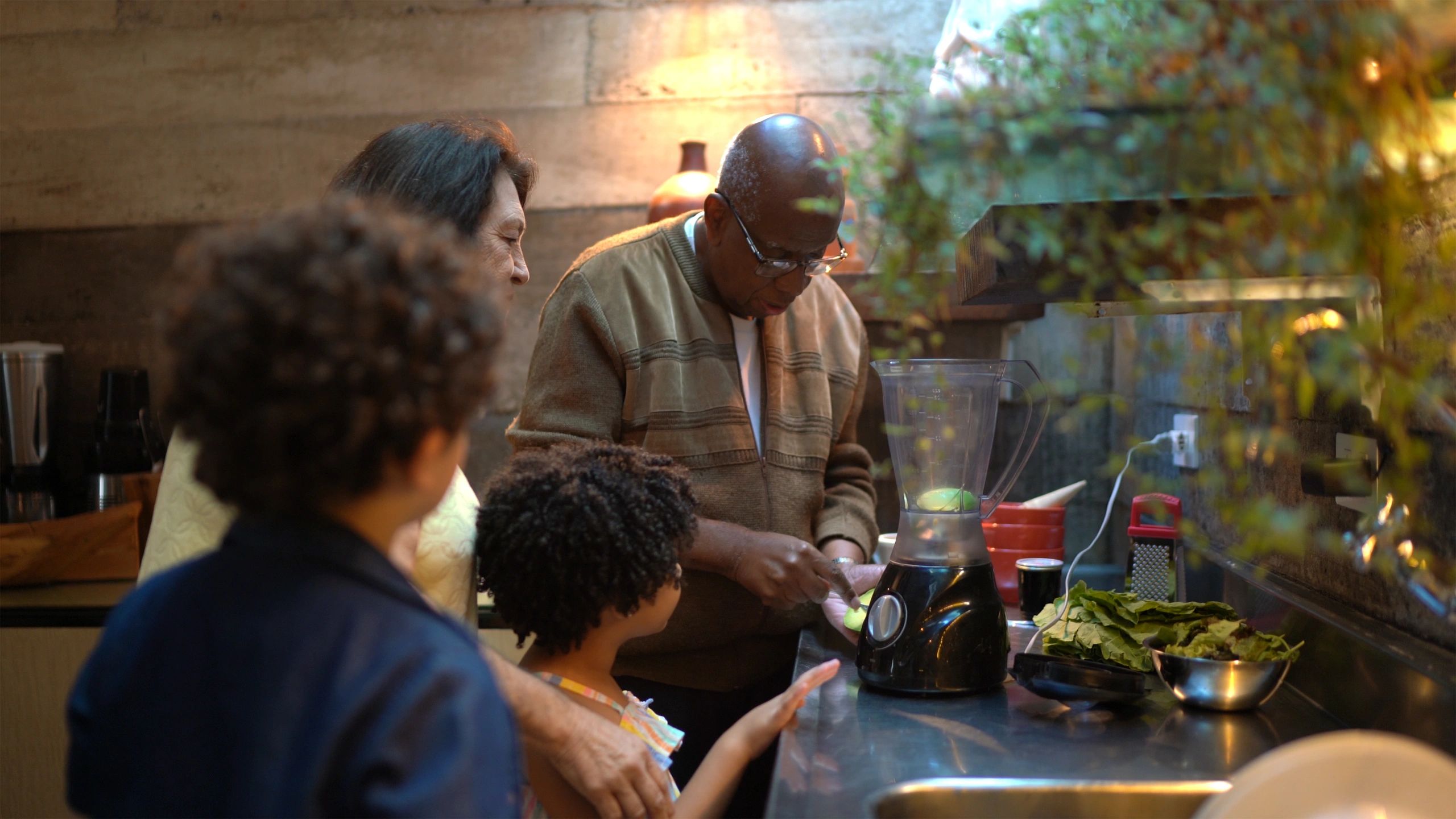 Family preparing healthy drinks together